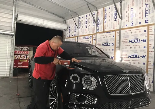 Applying Car Wax For a Limousine in a car garage next to the Ls Vegas Strip